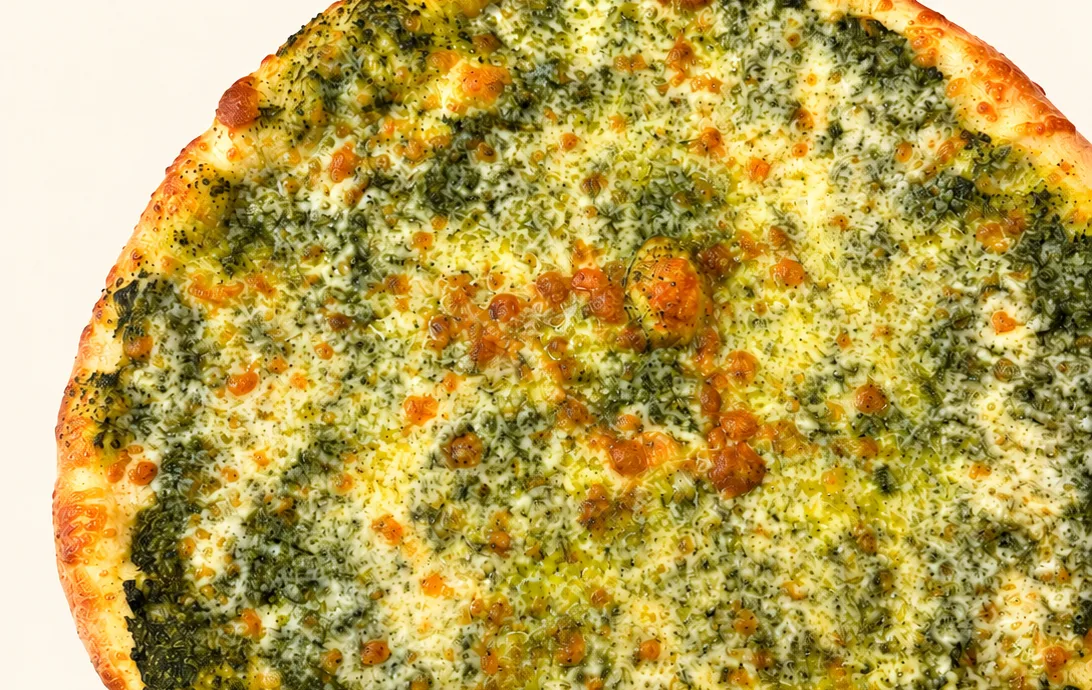 Pesto pizza with basil pesto and mozzarella